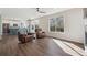 Open-concept living room with hardwood floors, fireplace, and abundant natural light creates an inviting atmosphere at 1534 Stanley Dr, Erie, CO 80516