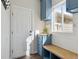 The mudroom features ample storage with custom cabinets, a bench seat, and convenient access to the outdoors at 1534 Stanley Dr, Erie, CO 80516