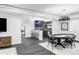 Beautiful basement featuring a bar with seating, a game table and plenty of space to entertain at 6037 N Netherland Ct, Aurora, CO 80019