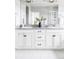 Bathroom vanity with double sinks, granite countertop, and stylish fixtures at 6037 N Netherland Ct, Aurora, CO 80019