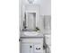 Bathroom features a granite vanity with a modern sink and a decorative mirror at 6037 N Netherland Ct, Aurora, CO 80019