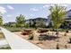 Inviting community area featuring picnic tables, a grill, and well-maintained landscaping amongst the neighborhood homes at 6037 N Netherland Ct, Aurora, CO 80019