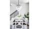 Stunning dining room area featuring decorative chandelier, table and greenery at 6037 N Netherland Ct, Aurora, CO 80019