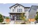 Charming two-story home featuring a covered porch and a beautifully designed exterior at 6037 N Netherland Ct, Aurora, CO 80019