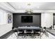 Fun game room with an elegant light fixture, a mounted TV, and a poker table with seating at 6037 N Netherland Ct, Aurora, CO 80019