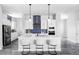 Beautiful kitchen with white cabinets, stylish backsplash, and sleek countertops at 6037 N Netherland Ct, Aurora, CO 80019