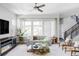 Comfortable living room with large windows, modern decor, and cozy seating area at 6037 N Netherland Ct, Aurora, CO 80019