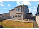 Spacious backyard with a concrete patio and lawn area at 18824 Robins Dr, Denver, CO 80249