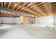 Unfinished basement with exposed beams and concrete floor, ready for customization at 18824 Robins Dr, Denver, CO 80249