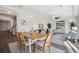 Bright dining area opens to the living room, offering a spacious and airy feel at 18824 Robins Dr, Denver, CO 80249