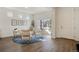 Bright living room with modern furniture, a blue rug, and plenty of natural light at 18824 Robins Dr, Denver, CO 80249