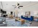 Well-lit living area adjacent to the kitchen and dining area, ideal for entertaining at 18824 Robins Dr, Denver, CO 80249
