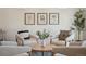 Close up of a modern living room with art prints, stylish furniture, and elegant decor at 18824 Robins Dr, Denver, CO 80249