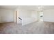Upstairs loft area featuring neutral carpeting and plenty of natural light at 18824 Robins Dr, Denver, CO 80249