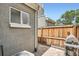 Enclosed patio with a gray brick wall, wooden fence, a grill, and space for outdoor living at 2564 N Emerson St, Denver, CO 80205