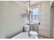 Bright bathroom showcasing a clawfoot tub, pedestal sink, and natural light at 2564 N Emerson St, Denver, CO 80205