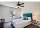 Charming bedroom with a ceiling fan, plush carpet, and plenty of natural light at 2564 N Emerson St, Denver, CO 80205