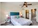 Comfortable bedroom with ceiling fan, closet, and two mirrored side tables at 2564 N Emerson St, Denver, CO 80205
