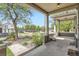 Charming front porch with decorative columns, offering a relaxing outdoor space with views of the neighborhood at 2564 N Emerson St, Denver, CO 80205