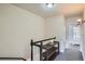 Bright hallway with gray carpet and decorative shelving, leading to a bedroom with a window at 2564 N Emerson St, Denver, CO 80205