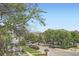 Scenic street view with lush trees, charming homes, and a glimpse of distant mountains at 2564 N Emerson St, Denver, CO 80205