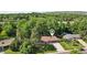 Aerial view of the property showing a well-maintained home with mature trees and landscaping at 13140 W 15Th Dr, Golden, CO 80401