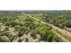 Wide aerial shot of a neighborhood with mature trees near the city at 13140 W 15Th Dr, Golden, CO 80401