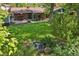 Landscaped backyard with a beautiful pond, mature trees and a patio at 13140 W 15Th Dr, Golden, CO 80401