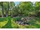 Backyard featuring a rock pond with a flowing water feature and garden area at 13140 W 15Th Dr, Golden, CO 80401