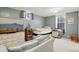 Cozy bedroom with natural light and striped accent seating at 13140 W 15Th Dr, Golden, CO 80401