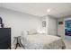 Bedroom featuring a patterned comforter, dark furniture, and neutral carpet at 13140 W 15Th Dr, Golden, CO 80401