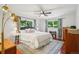 Serene bedroom with a comfortable queen-sized bed, natural light, and soft colors creating a peaceful retreat at 13140 W 15Th Dr, Golden, CO 80401