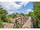 Charming bridge offering scenic views of the surrounding nature and lush greenery in a tranquil neighborhood at 13140 W 15Th Dr, Golden, CO 80401