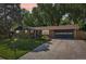Charming home featuring a well-maintained lawn, mature landscaping, and an inviting front entryway at 13140 W 15Th Dr, Golden, CO 80401