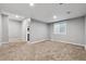 Finished basement featuring neutral paint, carpet, and a window for natural light at 76 N Ider St, Aurora, CO 80018
