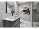 Bathroom featuring modern vessel sink, unique wall art, and stylish tile flooring at 76 N Ider St, Aurora, CO 80018