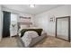Bright bedroom with a large bed, plush blankets, and calming decor at 76 N Ider St, Aurora, CO 80018