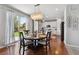 Dining Room featuring a dining table and a view of the kitchen and an outdoor view at 76 N Ider St, Aurora, CO 80018