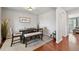 Nicely staged dining room with neutral colors and wood floors at 76 N Ider St, Aurora, CO 80018