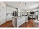 Modern kitchen featuring white cabinetry, stainless steel appliances, and a granite-topped island at 76 N Ider St, Aurora, CO 80018