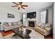 Cozy living room featuring a fireplace, hardwood floors, and comfortable seating at 76 N Ider St, Aurora, CO 80018