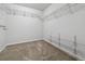 Empty walk-in closet with shelving and carpeting at 76 N Ider St, Aurora, CO 80018