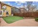 Backyard featuring a small patch of grass, partial fence, and patio at 263 N Logan St, Denver, CO 80203