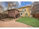Exterior view of backyard featuring manicured landscaping, pergola with seating and hot tub area at 263 N Logan St, Denver, CO 80203