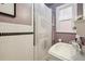Bathroom featuring stacked washer and dryer, black and white tile and modern sink at 263 N Logan St, Denver, CO 80203