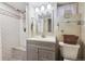 Well-lit bathroom showcasing subway tile shower, gray vanity, and modern fixtures at 263 N Logan St, Denver, CO 80203