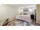 Neutral bedroom with a queen bed, simple decor, and wood floors topped with a gray area rug at 263 N Logan St, Denver, CO 80203