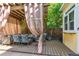 Outdoor covered patio with charming curtains, a dining table and comfortable chairs at 263 N Logan St, Denver, CO 80203
