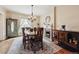 The dining room features updated lighting, wood floors, and a decorative fireplace at 263 N Logan St, Denver, CO 80203