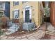 Close up of home's entry shows a decorative door surround and stone walkway at 263 N Logan St, Denver, CO 80203